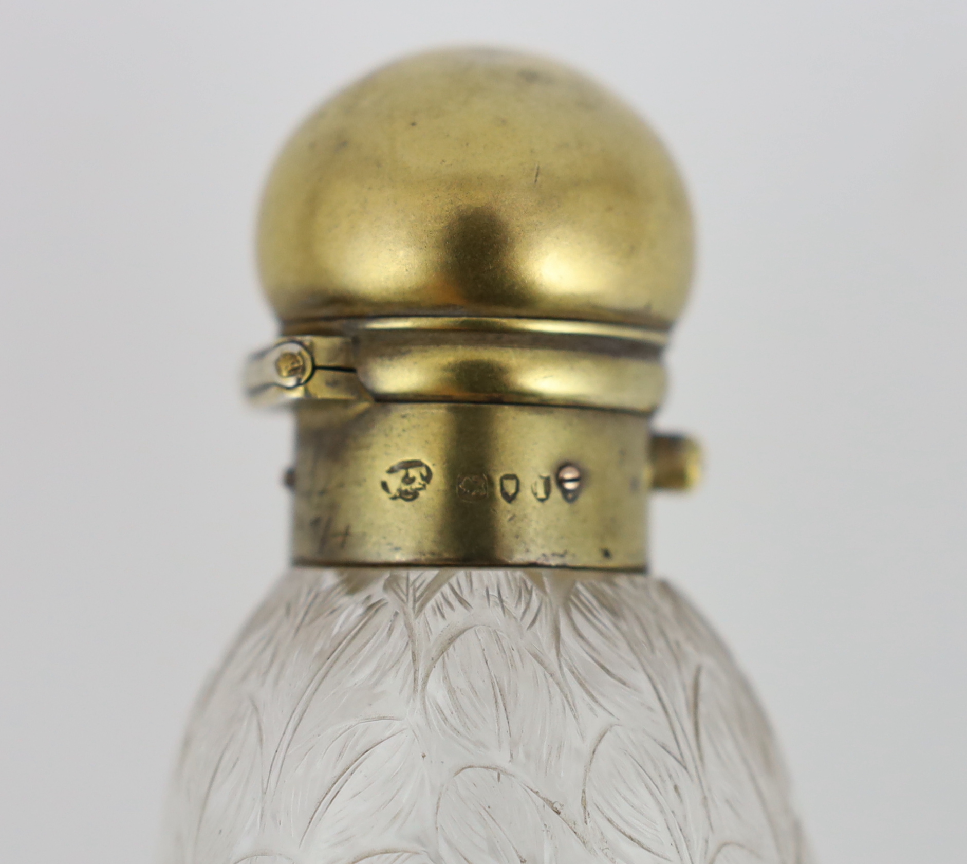 A Victorian silver gilt mounted moulded glass scent bottle, the glass body modelled as the head of a swan, by Walter Thornhill